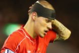Martin-Skrtel-looks-on-with-his-head-bandaged